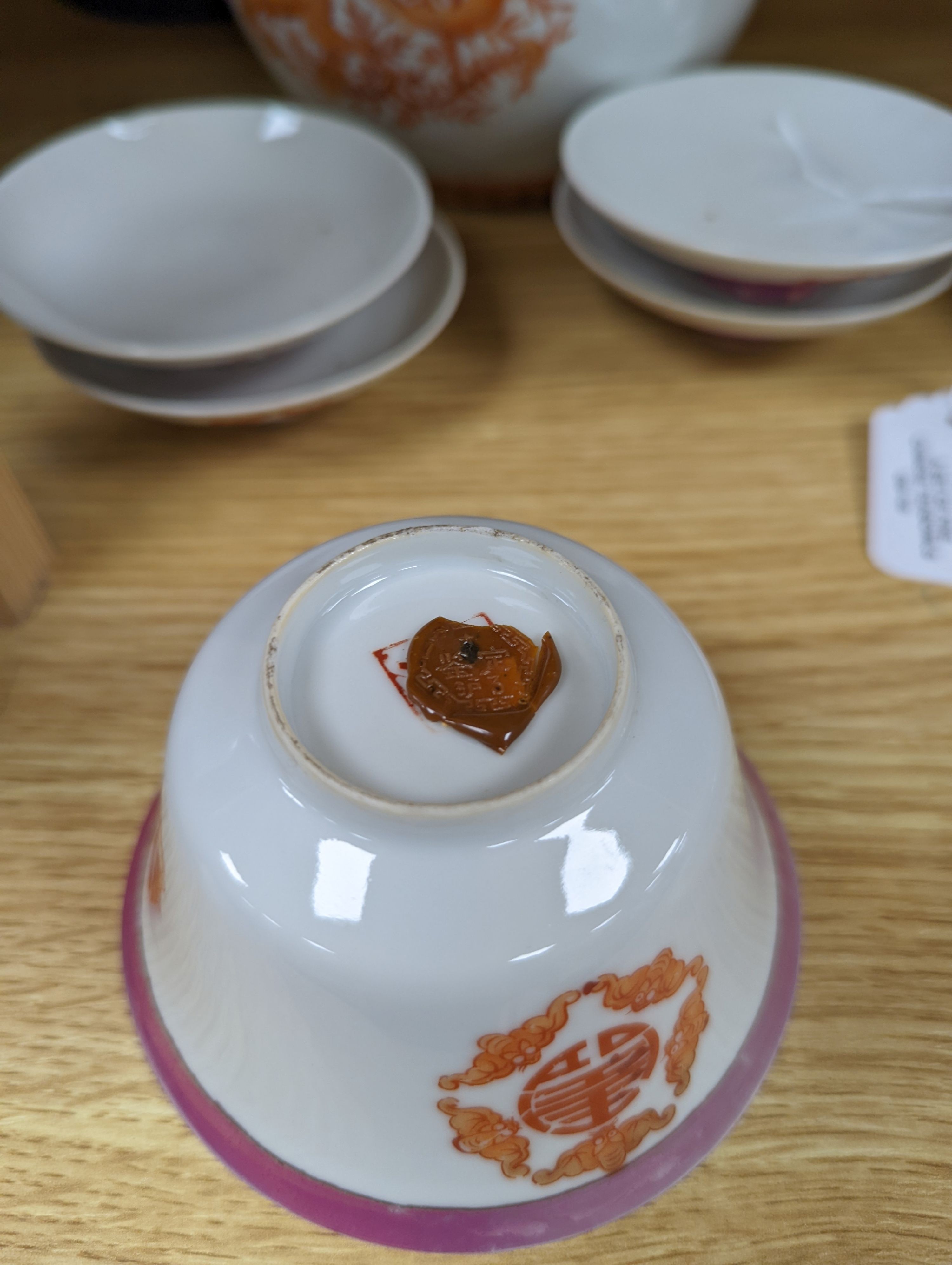 A set of five Chinese teabowls, covers and stands and a similar 'dragon' vase, 23cm